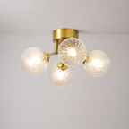 Modern Brass Four-Light Semi Flush Mount Ceiling Light with Clear Ribbed Glass Globe Bubbles